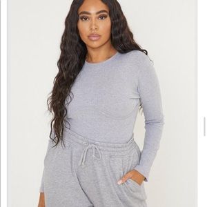 Brand new still in sealed packaging bodysuit.